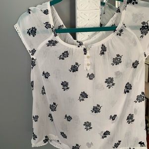 White blouse with black flowers